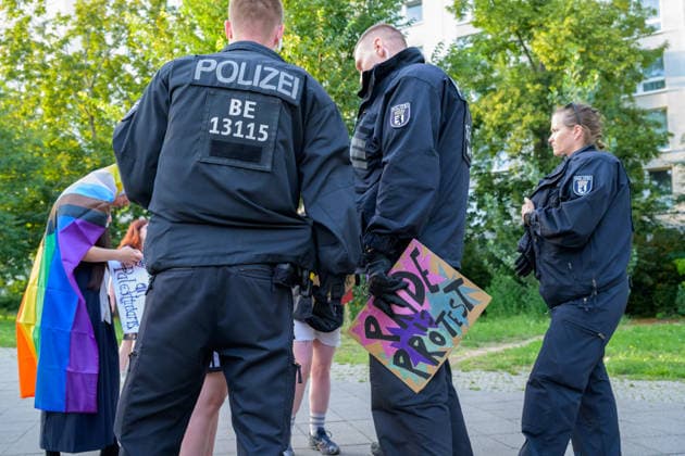 July 24, 2026, Berlin, Berlin, Germany: A police officer arrest one of the demonstrators because they hold a placard of a fist painted in the Palestine s flag colors at Dyke* March 2026, on July 24 2026, in Berlin, Germany. Thousands of demonstrators marched in the streets of Berlin s City Center and Kreuzberg districts for the annual Dyke* March just a day before the annual CSD parade and Internationalist Queer Pride Berlin Germany - ZUMAk201 20260724_zip_k201_012 Copyright: xNikosxKanistrasx