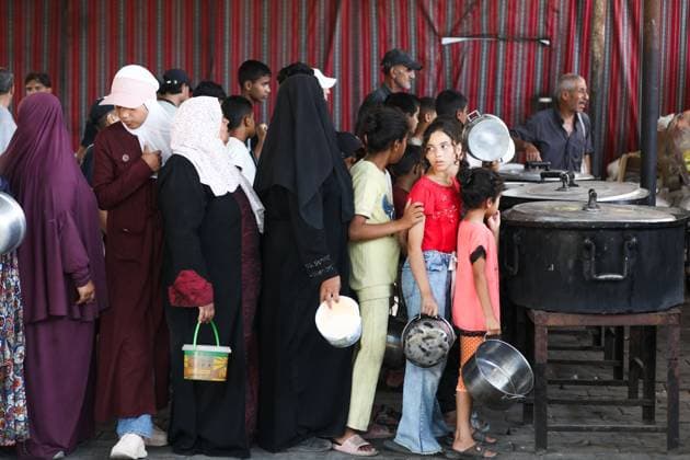 July 26, 2026, Al-Nuseirat Camp, Palestine, State of: AL-NUSEIRAT CAMP, GAZA STRIP Ã¢â‚¬ JULY 25, 2026: A charity kitchen in al-Nuseirat continues to distribute hot meals to displaced Palestinians, amid a severe hunger crisis driven by ongoing restrictions on humanitarian aid entry and a sharp decline in international funding for charity kitchens. Thousands of displaced familiesoÅ’ including children, women, and the elderlyoÅ’ rely on these kitchens as their near-sole source of daily meals, as UN agencies warn of worsening famine conditions across the Strip. Al-Nuseirat Camp Palestine, State of - ZUMAq101 20260726_zna_q101_006 Copyright: xRamzixAbuxAmerx
