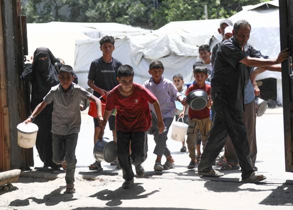 July 26, 2026, Al-Nuseirat Camp, Palestine, State of: AL-NUSEIRAT CAMP, GAZA STRIP Ã¢â‚¬ JULY 25, 2026: A charity kitchen in al-Nuseirat continues to distribute hot meals to displaced Palestinians, amid a severe hunger crisis driven by ongoing restrictions on humanitarian aid entry and a sharp decline in international funding for charity kitchens. Thousands of displaced familiesoÅ’ including children, women, and the elderlyoÅ’ rely on these kitchens as their near-sole source of daily meals, as UN agencies warn of worsening famine conditions across the Strip. Al-Nuseirat Camp Palestine, State of - ZUMAq101 20260726_zna_q101_014 Copyright: xRamzixAbuxAmerx