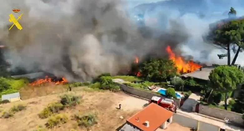 Hundreds of firefighters battle wildfires near Spanish capital MADRID, SPAIN - JULY 25: (----EDITORIAL USE ONLY - MANDATORY CREDIT - SPAIN S GUARDIA CIVIL HANDOUT - NO MARKETING NO ADVERTISING CAMPAIGNS - DISTRIBUTED AS A SERVICE TO CLIENTS----) A screen grab taken from a video shows the wildfire that swept through Spain as emergency crews continued efforts near the Madrid, Spain on July 25, 2026. Spain s Civil Protection agency reported that more than 650 personnel were deployed to the field to establish containment lines as dry, hot conditions persisted across the region. Spain s Guardia Civil Anadolu Madrid Spain. Editorial use only. Please get in touch for any other usage.  Copyright: x2026xAnadoluxSpain sxGuardiaxCivilx