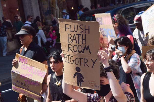 July 25, 2026, London, England, United Kingdom: A participant holds a sign about bathrooms during Trans Pride 2026 in Regent Street. London United Kingdom  - ZUMAv130 20260725_zip_v130_033 Copyright: xVukxValcicx