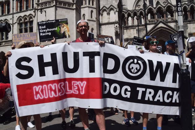 July 25, 2026, London, England, United Kingdom: Protesters hold a Shut down Kinsley dog track banner outside the Royal Courts of Justice during a march calling for an end to dog racing. The march dubbed Century of Suffering marks 100 years of greyhound racing in the UK. London United Kingdom  - ZUMAv130 20260725_zip_v130_069 Copyright: xVukxValcicx