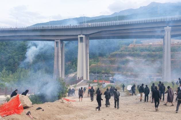 July 25, 2026, Chiomonte, Val Di Susa, Italy: CHIOMONTE, VAL DI SUSA, PIEDMONT, ITALY Ã¢â‚¬ JULY 25, 2026: Masked activists from the No TAV movement, a protest movement opposing the Turin-Lyon high-speed railway project, clash with security forces in Chiomonte, Val di Susa, Piedmont, Italy, after storming the high-speed rail construction site. Protesters threw rocks and firecrackers, setting fire to four vehicles belonging to the Carabinieri and Guardia di Finanza. Police responded with tear gas and water cannons, leaving more than 50 security personnel injured and forcing the closure of a section of the A32 Turin-Bardonecchia motorway. Chiomonte, Val Di Susa Italy - ZUMAq101 20260725_zna_q101_169 Copyright: xLeonardoxGaravagliax