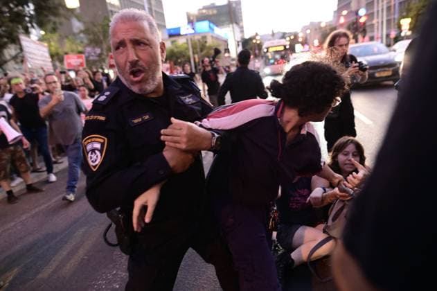 July 25, 2026, Tel-Aviv, Israel: TEL AVIV, ISRAEL Ã¢â‚¬ JULY 25, 2026: Dozens of protesters gather outside Israeli military headquarters (Kirya) in Tel Aviv to demonstrate against ongoing settler violence targeting Palestinians in the occupied West Bank. Clashes broke out with police after some demonstrators attempted to block the road. Tel-Aviv Israel - ZUMAq101 20260725_zna_q101_261 Copyright: xTomerxNeubergx