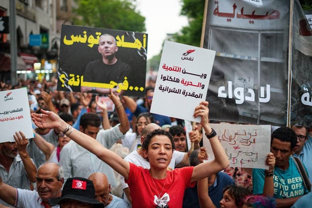 July 25, 2026, Tunis, Tunis, Tunisia, Tunisia: People hold placards and chant slogans during a protest against Tunisian President Kais Saied in downtown Tunis, Tunisia, on July 25, 2026. Demonstrators gathered on Republic Day to denounce the government s handling of prolonged power outages and recurring water cuts affecting regions across the country, while also criticizing President Saied s rule and demanding political and economic reforms. Tunis Tunisia  - ZUMAm342 20260725_zsp_m342_014 Copyright: xHasanxMradx