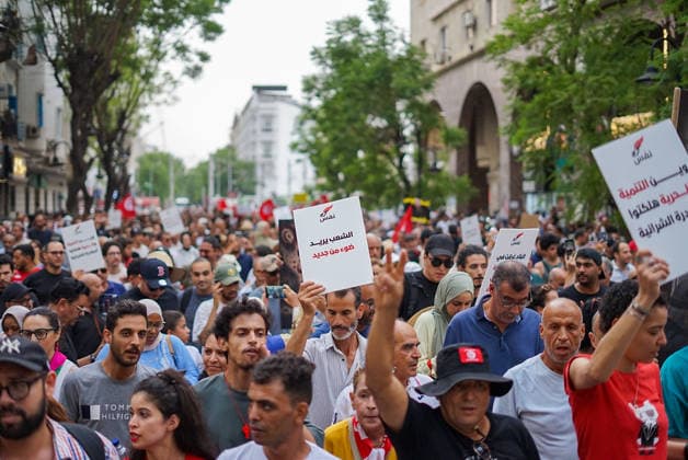 July 25, 2026, Tunis, Tunis, Tunisia, Tunisia: People hold placards and chant slogans during a protest against Tunisian President Kais Saied in downtown Tunis, Tunisia, on July 25, 2026. Demonstrators gathered on Republic Day to denounce the government s handling of prolonged power outages and recurring water cuts affecting regions across the country, while also criticizing President Saied s rule and demanding political and economic reforms. Tunis Tunisia - ZUMAm342 20260725_zsp_m342_010 Copyright: xHasanxMradx