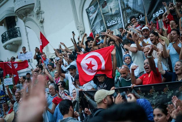 July 25, 2026, Tunis, Tunis, Tunisia, Tunisia: People hold placards and chant slogans during a protest against Tunisian President Kais Saied in downtown Tunis, Tunisia, on July 25, 2026. Demonstrators gathered on Republic Day to denounce the government s handling of prolonged power outages and recurring water cuts affecting regions across the country, while also criticizing President Saied s rule and demanding political and economic reforms. Tunis Tunisia - ZUMAm342 20260725_zsp_m342_022 Copyright: xHasanxMradx