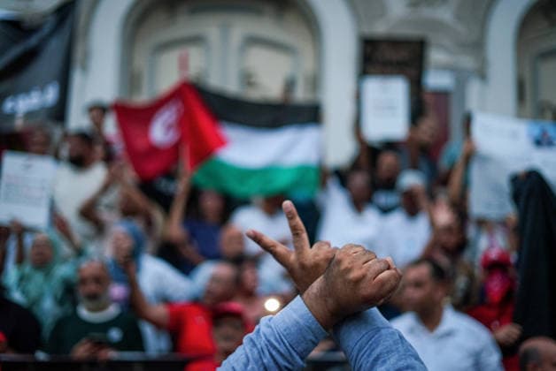 July 25, 2026, Tunis, Tunis, Tunisia, Tunisia: People hold placards and chant slogans during a protest against Tunisian President Kais Saied in downtown Tunis, Tunisia, on July 25, 2026. Demonstrators gathered on Republic Day to denounce the government s handling of prolonged power outages and recurring water cuts affecting regions across the country, while also criticizing President Saied s rule and demanding political and economic reforms. Tunis Tunisia - ZUMAm342 20260725_zsp_m342_029 Copyright: xHasanxMradx