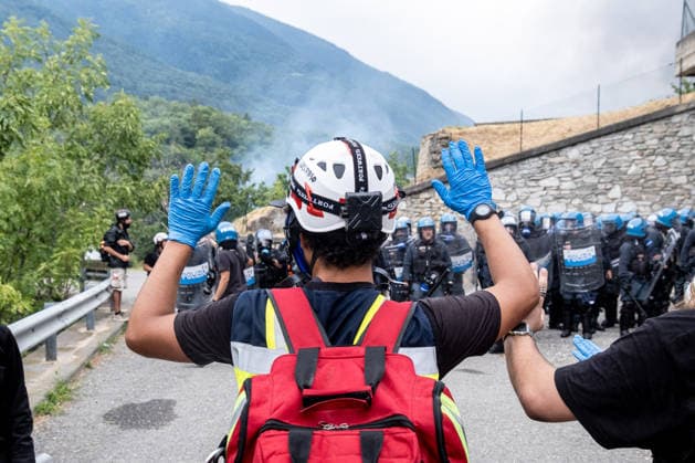 July 25, 2026, Susa, Piedmont, Italy: On July 25, 2026, thousands of people departed from AltaFelicito , a music festival in Venaus, to reach the construction sites of the TAV (High speed rail), a railway project to connect Italy and France. The demonstrators managed to enter the site and there clashed with the police, who responded with tear gas. Many of the buildings inside were put on fire, including two police vehicles. The TAV project has been highly contested during the last 30 years because of environmental damages and increasing costs. Susa Italy  - ZUMAs377 20260725_znp_s377_011 Copyright: xPietroxStariccox