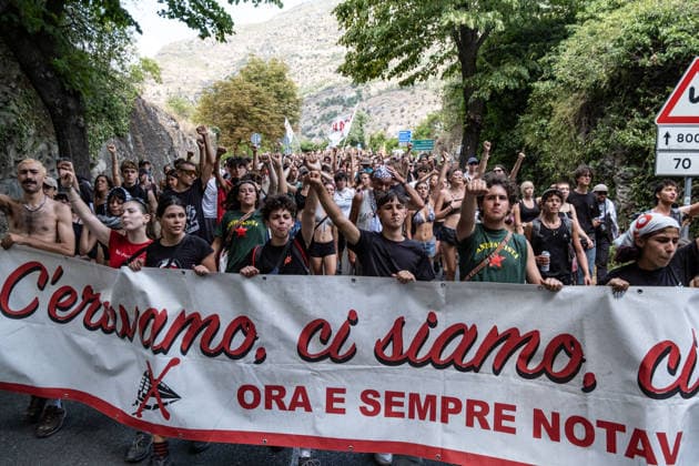 July 25, 2026, Susa, Piedmont, Italy: On July 25, 2026, thousands of people departed from AltaFelicito , a music festival in Venaus, to reach the construction sites of the TAV (High speed rail), a railway project to connect Italy and France. The demonstrators managed to enter the site and there clashed with the police, who responded with tear gas. Many of the buildings inside were put on fire, including two police vehicles. The TAV project has been highly contested during the last 30 years because of environmental damages and increasing costs. Susa Italy  - ZUMAs377 20260725_znp_s377_020 Copyright: xPietroxStariccox