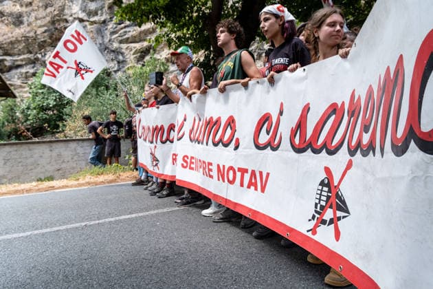 July 25, 2026, Susa, Piedmont, Italy: On July 25, 2026, thousands of people departed from AltaFelicito , a music festival in Venaus, to reach the construction sites of the TAV (High speed rail), a railway project to connect Italy and France. The demonstrators managed to enter the site and there clashed with the police, who responded with tear gas. Many of the buildings inside were put on fire, including two police vehicles. The TAV project has been highly contested during the last 30 years because of environmental damages and increasing costs. Susa Italy  - ZUMAs377 20260725_znp_s377_022 Copyright: xPietroxStariccox