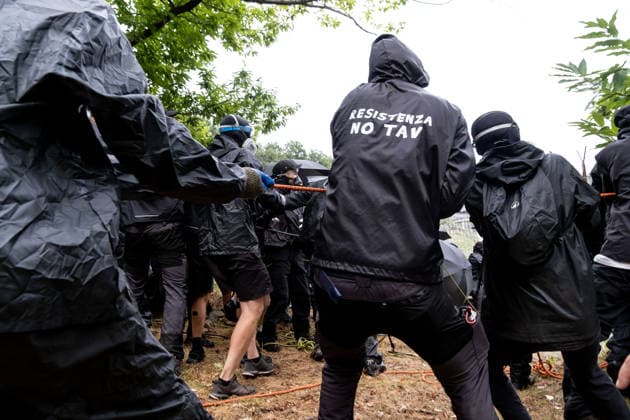 July 25, 2026, Susa, Piedmont, Italy: On July 25, 2026, thousands of people departed from AltaFelicito , a music festival in Venaus, to reach the construction sites of the TAV (High speed rail), a railway project to connect Italy and France. The demonstrators managed to enter the site and there clashed with the police, who responded with tear gas. Many of the buildings inside were put on fire, including two police vehicles. The TAV project has been highly contested during the last 30 years because of environmental damages and increasing costs. Susa Italy  - ZUMAs377 20260725_znp_s377_025 Copyright: xPietroxStariccox
