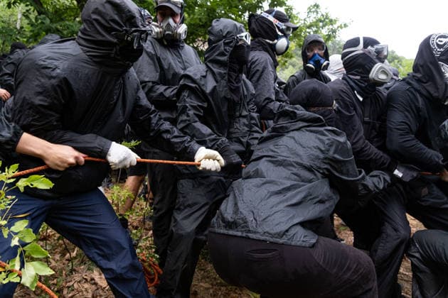 July 25, 2026, Susa, Piedmont, Italy: On July 25, 2026, thousands of people departed from AltaFelicito , a music festival in Venaus, to reach the construction sites of the TAV (High speed rail), a railway project to connect Italy and France. The demonstrators managed to enter the site and there clashed with the police, who responded with tear gas. Many of the buildings inside were put on fire, including two police vehicles. The TAV project has been highly contested during the last 30 years because of environmental damages and increasing costs. Susa Italy  - ZUMAs377 20260725_znp_s377_026 Copyright: xPietroxStariccox