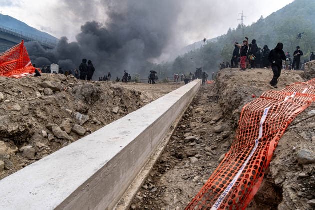 July 25, 2026, Susa, Piedmont, Italy: On July 25, 2026, thousands of people departed from AltaFelicito , a music festival in Venaus, to reach the construction sites of the TAV (High speed rail), a railway project to connect Italy and France. The demonstrators managed to enter the site and there clashed with the police, who responded with tear gas. Many of the buildings inside were put on fire, including two police vehicles. The TAV project has been highly contested during the last 30 years because of environmental damages and increasing costs. Susa Italy  - ZUMAs377 20260725_znp_s377_042 Copyright: xPietroxStariccox