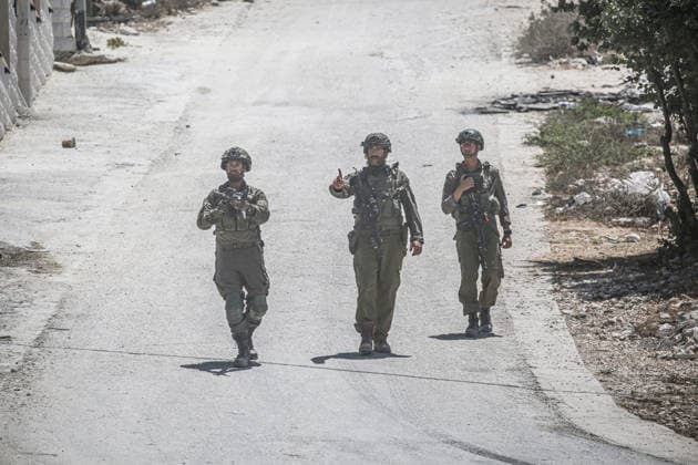 July 25, 2026, Nablus, West Bank, Palestine: Israeli soldiers deployed in the street as they surrounded the home of the Palestinian man who shot a settler in self-defense after a group of Jewish settlers stormed his house. This attack came in retaliation for the killing of two settlers and four Palestinians in Tell, southwest of Nablus in the West Bank. In response, settlers set fire to Palestinian cars and homes in Tell and the neighboring village of Qalqilya Sara. Meanwhile, the Israeli army announced its readiness for a military operation in the northern West Bank, which is under the control of the Palestinian Authority. Nablus Palestine - ZUMAs197 20260725_aaa_s197_235 Copyright: xNasserxishatyehx