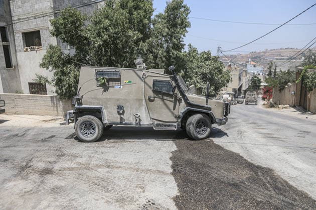 July 25, 2026, Nablus, West Bank, Palestine: Israeli military vehicles seen patrolling the streets as they surrounded the home of the Palestinian man who shot a settler in self-defense after a group of Jewish settlers stormed his house. This attack came in retaliation for the killing of two settlers and four Palestinians in Tell, southwest of Nablus in the West Bank. In response, settlers set fire to Palestinian cars and homes in Tell and the neighboring village of Qalqilya Sara. Meanwhile, the Israeli army announced its readiness for a military operation in the northern West Bank, which is under the control of the Palestinian Authority. Nablus Palestine - ZUMAs197 20260725_aaa_s197_243 Copyright: xNasserxishatyehx