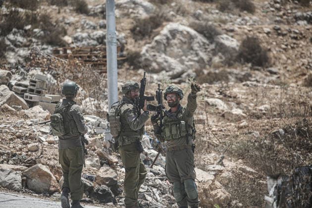July 25, 2026, Nablus, West Bank, Palestine: Israeli soldiers deployed in the street as they surrounded the home of the Palestinian man who shot a settler in self-defense after a group of Jewish settlers stormed his house. This attack came in retaliation for the killing of two settlers and four Palestinians in Tell, southwest of Nablus in the West Bank. In response, settlers set fire to Palestinian cars and homes in Tell and the neighboring village of Qalqilya Sara. Meanwhile, the Israeli army announced its readiness for a military operation in the northern West Bank, which is under the control of the Palestinian Authority. Nablus Palestine - ZUMAs197 20260725_aaa_s197_244 Copyright: xNasserxishatyehx