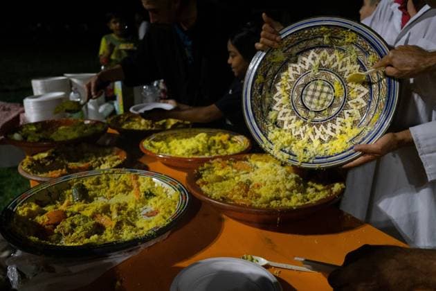 July 25, 2026, Bologna, IT: BOLOGNA, ITALY - JULY 25, 2026: Large crowds gather for a dinner and vigil in memory of Abderrahim Fakir at Pilastro Park, Bologna. The neighborhood event was organized by local grassroots committees together with Fakir s family, following days of citywide mobilization to commemorate the 42-year-old Moroccan man who died on July 19 during a police stop. JNA Press Bologna IT - ZUMAq101 20260725_zna_q101_349 Copyright: xThomasxCavagnax