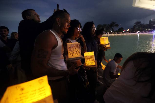 July 25, 2026, Rio De Janeiro, Rio De Janeiro, Brazil: Hundreds came to the inaugural Water Lantern Festival at the Museum of Tomorrow (Museu do AmanhoÂ£) in Rio de Janeiro, Brazil to release illuminated water lanterns fitted with small LED lights. Participants personalized the floating lanterns with messages before setting them on the water at sunset, creating a display intended to symbolize hope, healing, remembrance and unity. The festival, which is held annually in dozens of cities around the world, including New York, Los Angeles, Toronto, London and Sydney, made its Brazil debut in Rio de Janeiro. Rio De Janeiro Brazil - ZUMAk251 20260725_znp_k251_007 Copyright: xBobxKarpx