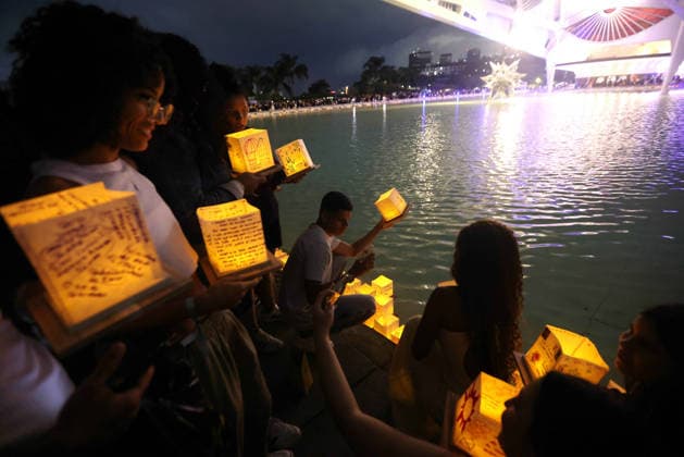 July 25, 2026, Rio De Janeiro, Rio De Janeiro, Brazil: Hundreds came to the inaugural Water Lantern Festival at the Museum of Tomorrow (Museu do AmanhoÂ£) in Rio de Janeiro, Brazil to release illuminated water lanterns fitted with small LED lights. Participants personalized the floating lanterns with messages before setting them on the water at sunset, creating a display intended to symbolize hope, healing, remembrance and unity. The festival, which is held annually in dozens of cities around the world, including New York, Los Angeles, Toronto, London and Sydney, made its Brazil debut in Rio de Janeiro. Rio De Janeiro Brazil - ZUMAk251 20260725_znp_k251_013 Copyright: xBobxKarpx