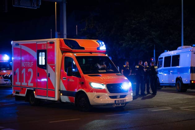 (260726) -- BERLIN, July 26, 2026 -- An ambulance arrives at the site where a car drove into a crowd in Berlin, Germany, July 26, 2026. One person was killed and 16 others were injured, including several with life-threatening injuries, after a car drove into a crowd at a large Pride celebration in central Berlin on Saturday evening, a police spokesperson said. ) (SpotNews) GERMANY-BERLIN-CAR CRASH ZhangxHaofu 