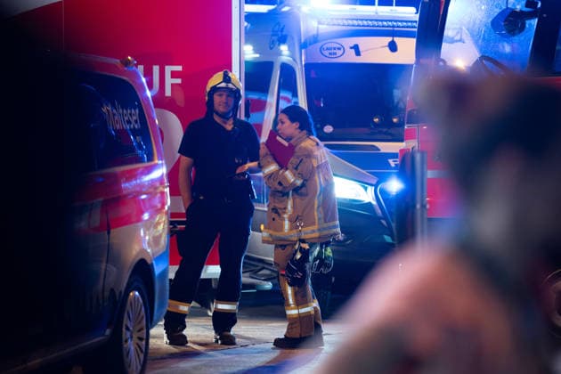 (260726) -- BERLIN, July 26, 2026 -- Rescuers work near the site where a car drove into a crowd in Berlin, Germany, July 26, 2026. One person was killed and 16 others were injured, including several with life-threatening injuries, after a car drove into a crowd at a large Pride celebration in central Berlin on Saturday evening, a police spokesperson said. ) (SpotNews) GERMANY-BERLIN-CAR CRASH ZhangxHaofu 