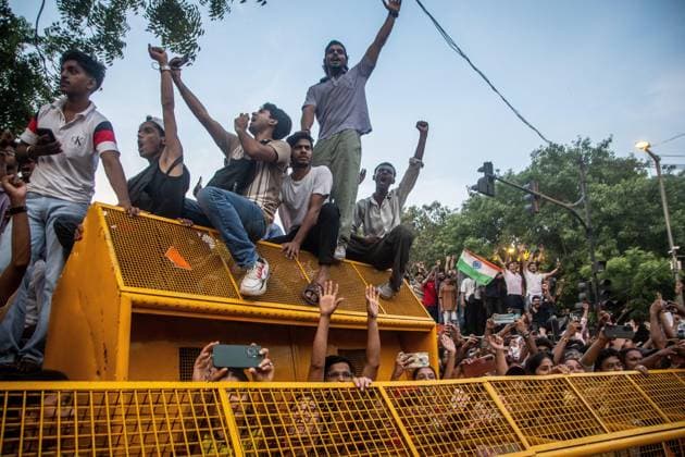 July 25, 2026, New Delhi, India: NEW DELHI, INDIA Ã¢â‚¬ JULY 25, 2026: Student protesters celebrate at Jantar Mantar following the resignation of India s Union Education Minister Dharmendra Pradhan, in New Delhi, India. Demonstrators hold placards reading Jeet ( Victory ), wave the Indian national flag and climb police barricades after the announcement, following days of nationwide protests over alleged irregularities in the country s education system. New Delhi India - ZUMAq101 20260725_zna_q101_364 Copyright: xAmitxShuklax