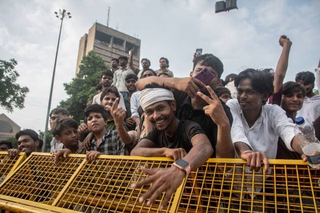 July 25, 2026, New Delhi, India: NEW DELHI, INDIA Ã¢â‚¬ JULY 25, 2026: Student protesters celebrate at Jantar Mantar following the resignation of India s Union Education Minister Dharmendra Pradhan, in New Delhi, India. Demonstrators hold placards reading Jeet ( Victory ), wave the Indian national flag and climb police barricades after the announcement, following days of nationwide protests over alleged irregularities in the country s education system. New Delhi India - ZUMAq101 20260725_zna_q101_383 Copyright: xAmitxShuklax