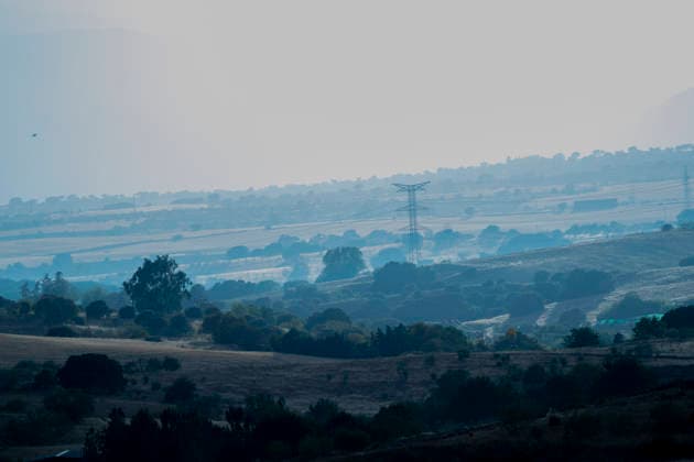 Smoke plumes from the IFSierraOeste wildfire rise over the Sierra Oeste area of the Madrid region as seen from Navalcarnero on 25 July 2026. The blaze which merged fires in Villa del Prado San Martin de Valdeiglesias and Almorox forced the evacuation of thousands of people in the region. July 25, 2026. (202607251314)