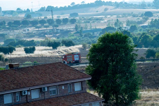 A fire truck drives along a road in the Madrid region heading toward the area affected by the Sierra Oeste wildfire which keeps hundreds of firefighting personnel deployed in the region. July 25, 2026. (202607251316)