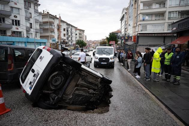 Heavy rainfall causes flooding, road collapse in Ankara ANKARA, TURKIYE - JULY 25: A car is seen trapped in a sinkhole after the road collapsed following heavy rainfall in Ankara, Turkiye, on July 25, 2026. Intense morning downpours caused sections of the road to give way, leaving the vehicle partially submerged. Muhammed Abdullah Kurtar Anadolu Ankara Turkey. Editorial use only. Please get in touch for any other usage.  Copyright: x2026xAnadoluxMuhammedxAbdullahxKurtarx