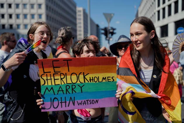 Christopher Street Day Pride Parade Berlin A participant holds a placard reading Let Sherlock Holmes Marry John Watson during the Christopher Street Day (CSD) Pride parade in Berlin, Germany, on July 25, 2026. The annual event celebrates LGBTQIA+ pride while advocating for equality, diversity, and human rights under the 2026 slogan Taking a stand is Hot. Berlin State of Berlin Germany Copyright: xBabakxBordbarx