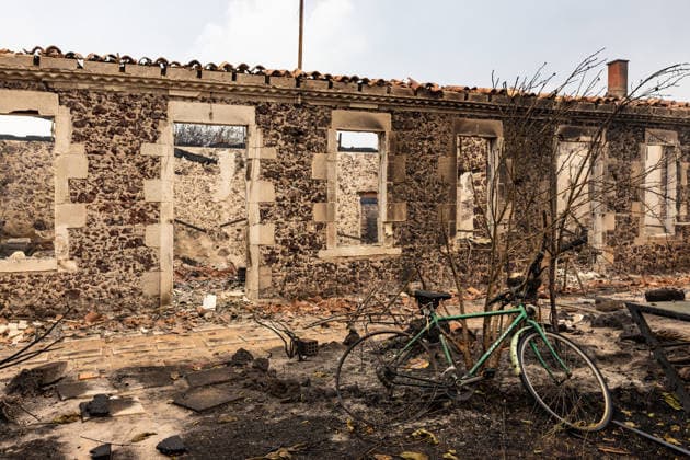 Wildfire evacuees shelter at Bordeaux Exhibition Centre - Bordeaux Burned residential properties are seen after the passage of the wildfire, smoke continues to rise from the affected areas as firefighters monitor remaining hotspots in Lège, France, on July 25, 2026. Photo by Margot Le Gonidec ABACAPRESS.COM Bordeaux France  Copyright: xLexGonidecxMargot ABACAx