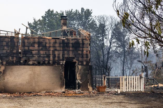 Wildfire evacuees shelter at Bordeaux Exhibition Centre - Bordeaux Burned residential properties are seen after the passage of the wildfire, smoke continues to rise from the affected areas as firefighters monitor remaining hotspots in Lège, France, on July 25, 2026. Photo by Margot Le Gonidec ABACAPRESS.COM Bordeaux France  Copyright: xLexGonidecxMargot ABACAx