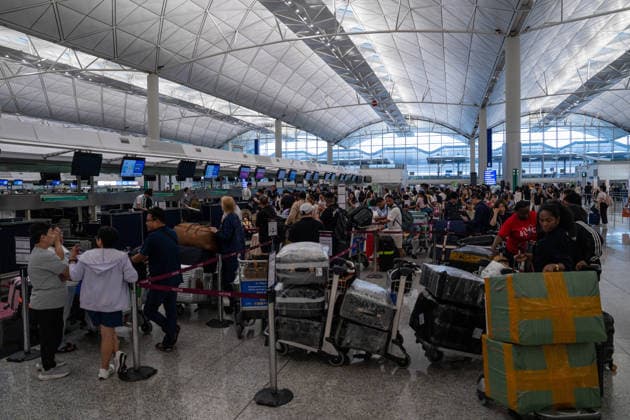 HONGKONG-TYPHOON NOUL Travelers lining up to check in inside terminal 1 at Hong Kong International Airpot during typhoon Noul in Hong Kong, July 26, 2026. NEXPHER Vernon Yuen HONG KONG