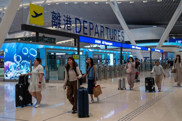 HONGKONG-TYPHOON NOUL Travelers walking pass the departure hall inside terminal 2 at Hong Kong International Airpot during typhoon Noul in Hong Kong, July 26, 2026. NEXPHER Vernon Yuen HONG KONG