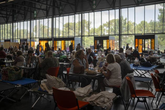 Bordeaux Exhibition Centre Shelters Evacuees from Wildfires BORDEAUX, FRANCE - JULY 26 : The Parc des Expositions de Bordeaux-Lac, located on Cours Jules Ladoumegue, serves as one of the main reception centers for people evacuated due to severe wildfires affecting the Gironde department in southwestern France, providing temporary accommodation, basic services, and logistical support through Gate M as firefighters continue efforts to contain the blaze on July 26, 2026 in Bordeaux, France. Authorities have urged residents to follow official instructions until the situation is brought under control in Bordeaux. Lorena Sopena Lopez Anadolu Bordeaux France. Editorial use only. Please get in touch for any other usage.  Copyright: x2026xAnadoluxLorenaxSopenaxLopezx