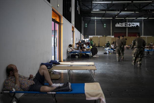 Bordeaux Exhibition Centre Shelters Evacuees from Wildfires BORDEAUX, FRANCE - JULY 26 : The Parc des Expositions de Bordeaux-Lac, located on Cours Jules Ladoumegue, serves as one of the main reception centers for people evacuated due to severe wildfires affecting the Gironde department in southwestern France, providing temporary accommodation, basic services, and logistical support through Gate M as firefighters continue efforts to contain the blaze on July 26, 2026 in Bordeaux, France. Authorities have urged residents to follow official instructions until the situation is brought under control in Bordeaux. Lorena Sopena Lopez Anadolu Bordeaux France. Editorial use only. Please get in touch for any other usage.  Copyright: x2026xAnadoluxLorenaxSopenaxLopezx