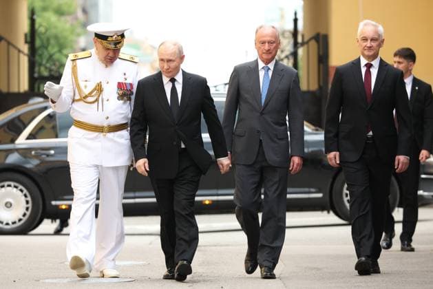 Russia Putin North Western Federal District 9212255 26.07.2026 Russian President Vladimir Putin, accompanied by Commander-in-Chief of the Russian Navy Admiral Alexander Moiseev, Presidential Aide and Chairman of the Marine Board Nikolai Patrushev and Defence Minister Andrei Belousov, arrives to attend a meeting with military commanders on Navy Day at the Admiralty headquarters in St. Petersburg, Russia. Petr Kovalev Sputnik St. Petersburg Russia  Copyright: xPetrxKovalevx
