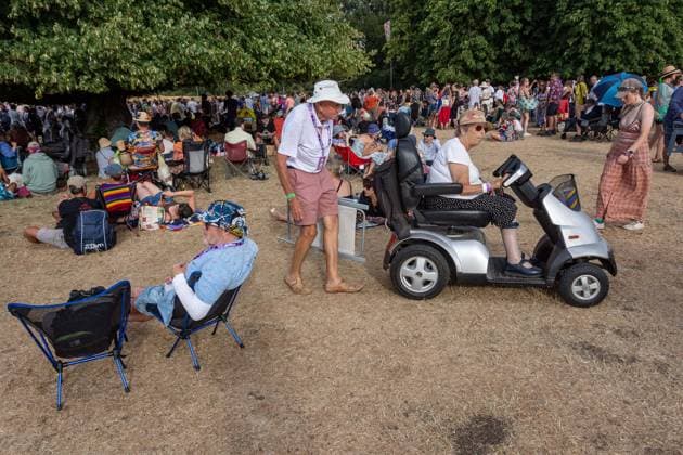 July 26, 2026, Corsham, Wiltshire, England: Festival goers enjoy a sunny Saturday at WOMAD Festival at Neston Park in Wiltshire. Corsham United Kingdom  - ZUMAr169 20260726_zip_r169_016 Copyright: xRodxHarbinsonx