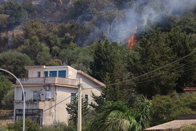 Firefighters battle wildfire near Italy s Palermo PALERMO, ITALY - JULY 26: Firefighter crews launched an aerial and ground response to contain a wildfire that broke out in scrubland near Torretta, outside Palermo on the island of Sicily, Italy on July 26, 2026. Fire engines and two firefighting aircraft were deployed as the blaze threatened nearby residential areas. Alberto Lo Bianco Anadolu Sicily Italy. Editorial use only. Please get in touch for any other usage.  Copyright: x2026xAnadoluxAlbertoxLoxBiancox
