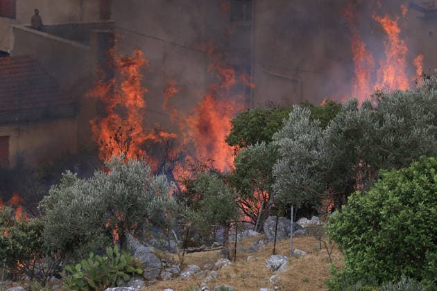 Firefighters battle wildfire near Italy s Palermo PALERMO, ITALY - JULY 26: Firefighter crews launched an aerial and ground response to contain a wildfire that broke out in scrubland near Torretta, outside Palermo on the island of Sicily, Italy on July 26, 2026. Fire engines and two firefighting aircraft were deployed as the blaze threatened nearby residential areas. Alberto Lo Bianco Anadolu Sicily Italy. Editorial use only. Please get in touch for any other usage.  Copyright: x2026xAnadoluxAlbertoxLoxBiancox