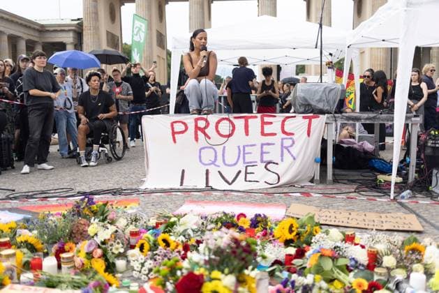 July 26, 2026, Berlin, Berlin, Germany: BERLIN, GERMANY Ã¢â‚¬ JULY 26, 2026: People gather for a vigil at the Brandenburg Gate in Berlin, Germany, in solidarity with those affected by the deadly attack near the city s Christopher Street Day (CSD) Pride celebrations a day earlier. Members of the LGBTQIA+ community and allies mourned the victims, called for unity and reaffirmed their commitment to combating homophobia, transphobia, fascism and all forms of hatred. Speakers also urged politicians and the media not to exploit the tragedy to promote Islamophobic, anti-Arab or other discriminatory narratives. Berlin Germany  - ZUMAq101 20260726_zna_q101_195 Copyright: xZairaxBiaginix