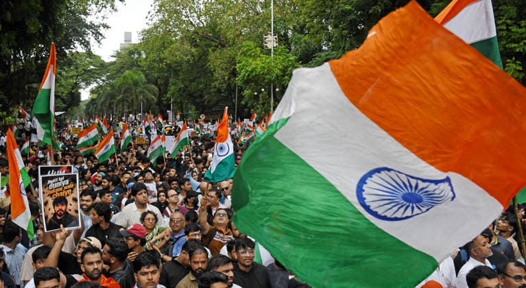 Celebrations after the resignation of Union Education Minister Dharmendra Pradhan in Mumbai, India - 26 Jul 2026 Citizens seen waving the Indian national flag during a celebration held after the resignation of Union Education Minister Dharmendra Pradhan. Youth led Cockroach Janata Party (CJP) protest which lasted for 36 days concluded on July 25 2026 after the government accepted the key demands put forth by leaders of Cockroach Janata Party (CJP) alongside resignation of Union Education Minister Dharmendra Pradhan in alleged paper leaks and irregularities found in major national medical entrance examinations. Mumbai India Copyright: xAshishxVaishnavx xSOPAxImagesx AVaishnav_Celebration after resignation of Union Education Minister Dharmendra Pradhan in Mumbai(10)