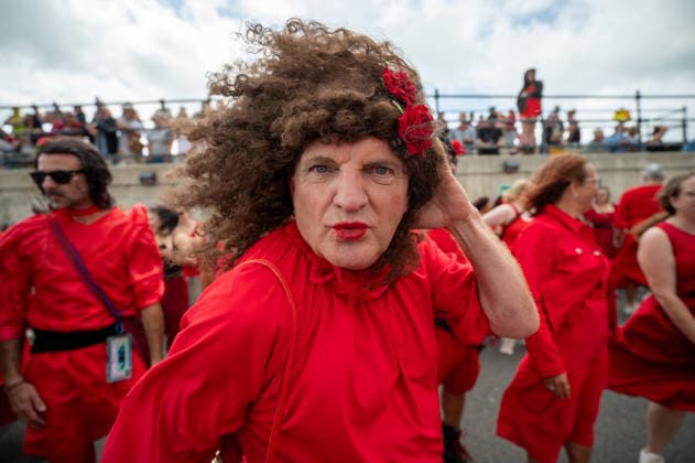 The Most Wuthering Day Ever in Folkestone, UK - 26 Jul 2026 A participant dressed as Cathy takes part in the Most Wuthering Heights Day Ever in Folkestone. Folkestone once again hosted The Most Wuthering Heights Day Ever, as hundreds of participants dressed in flowing red gathered to recreate the iconic dance from Kate Bush s 1978 hit, Wuthering Heights. Continuing a tradition that began in 2018, the event welcomed both returning dancers and newcomers, celebrating music, creativity, and community while transforming the Harbour Arm into a sea of red. Folkstone United Kingdom Copyright: xJamesxWilloughbyx xSOPAxImagesx JWILLOUGHBY_3086