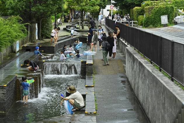 Sudden summer thunderstorm interrupts relief from Tokyo heat TOKYO, JAPAN - JULY 26 : Families and children enjoy a public water playground to cool off during hot summer weather in Tokyo, Japan, on July 26, 2026, shortly before a thunderstorm moved across the area. David Mareuil Anadolu Tokyo Japan. Editorial use only. Please get in touch for any other usage.  Copyright: x2026xAnadoluxDavidxMareuilx