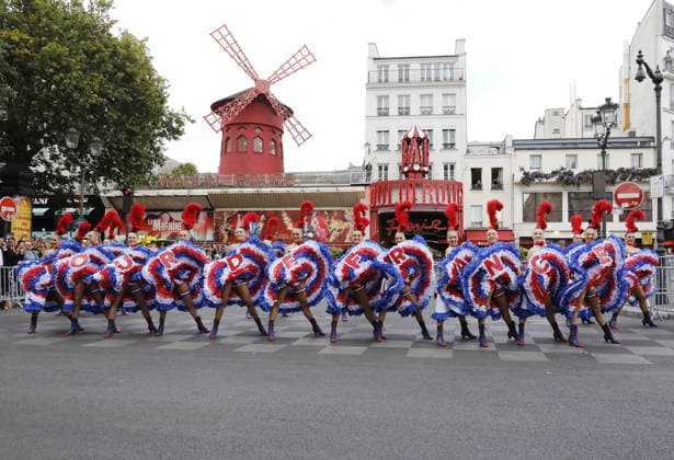 Tour de France cyclists pass by the Moulin Rouge during the final stage in Paris on July 26, 2026. The Moulin Rouge dancers perform before the Tour de France cyclists pass by. On this exceptional occasion, the famous Moulin Rouge dancers step out in front of the cabaret to put on a unique show. Dressed in their flamboyant tricolor costumes, they perform their iconic French Cancan to cheer on the cyclists as they enter the final stretch of their epic journey Marc Ausset Lacroix Bestimage Tour de France riders passing the Moulin Rouge during the final stage in Paris on July 26, 2026—Moulin Rouge dancers perform before the riders pass by For this special occasion, the famous Moulin Rouge dancers step out in front of the cabaret to put on a un  Copyright: xMarcxAussetxLacroixx xBestimagexMarcxAussetxLacroixx xBestimagex