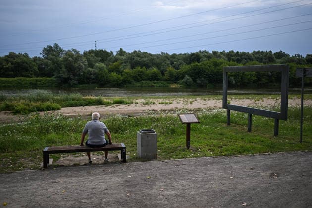 Poland s San River with low water levels as drought intensifies STALOWA WOLA, POLAND- JULY 27: A man looks at the San River with low water levels due to the ongoing drought in Poland in Stalowa Wola, Poland on July 27, 2026. Currently, low water levels have been recorded at 66 percent of Poland’s hydrological stations. Warnings over worsening dry conditions were issued earlier in July, when Poland’s national weather agency said hydrological drought had spread across much of the country. Officials reported falling river levels, reduced groundwater supplies and more monitoring stations recording flows below long-term minimum thresholds. At the end of this week, a heatwave is predicted with temperatures to raise above 35 Celsius degrees. Oma  Copyright: x2026xAnadoluxOmarxMarquesx