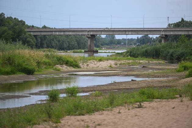 Poland s San River with low water levels as drought intensifies STALOWA WOLA, POLAND- JULY 27: A view of San River with low water levels due to the ongoing drought in Poland in Stalowa Wola, Poland on July 27, 2026. Currently, low water levels have been recorded at 66 percent of Poland’s hydrological stations. Warnings over worsening dry conditions were issued earlier in July, when Poland’s national weather agency said hydrological drought had spread across much of the country. Officials reported falling river levels, reduced groundwater supplies and more monitoring stations recording flows below long-term minimum thresholds. At the end of this week, a heatwave is predicted with temperatures to raise above 35 Celsius degrees. Omar Marques  Copyright: x2026xAnadoluxOmarxMarquesx