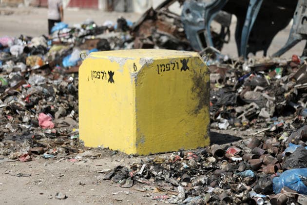 Yellow concrete blocks mark expanded Israeli-controlled area in Shujaiya Yellow concrete blocks are seen in the Shujaiya neighborhood east of Gaza City, Gaza Strip, on July 27, 2026, following an Israeli ground incursion into the area. Residents said Israeli forces placed the blocks to expand the area under their control along what is locally known as the Yellow Line, as the military operation left widespread destruction in residential neighborhoods. Photo by Bilal Osama apaimages Gaza city Gaza Strip Palestinian Territory 270726_Gaza_BO_01(30) Copyright: xapaimagesxBilalxOsamax xapaimagesx